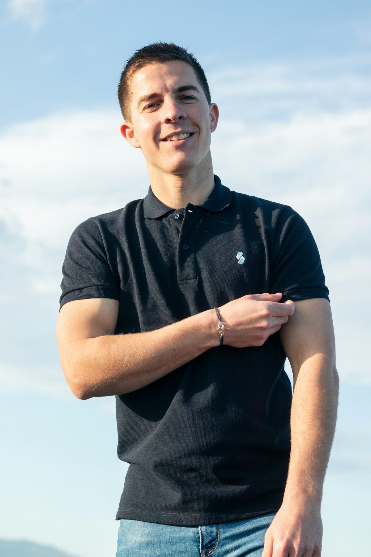 Man in a black polo shirt
