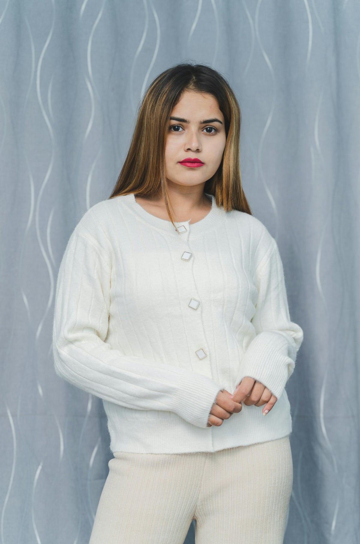 Woman in a white sweater and pants